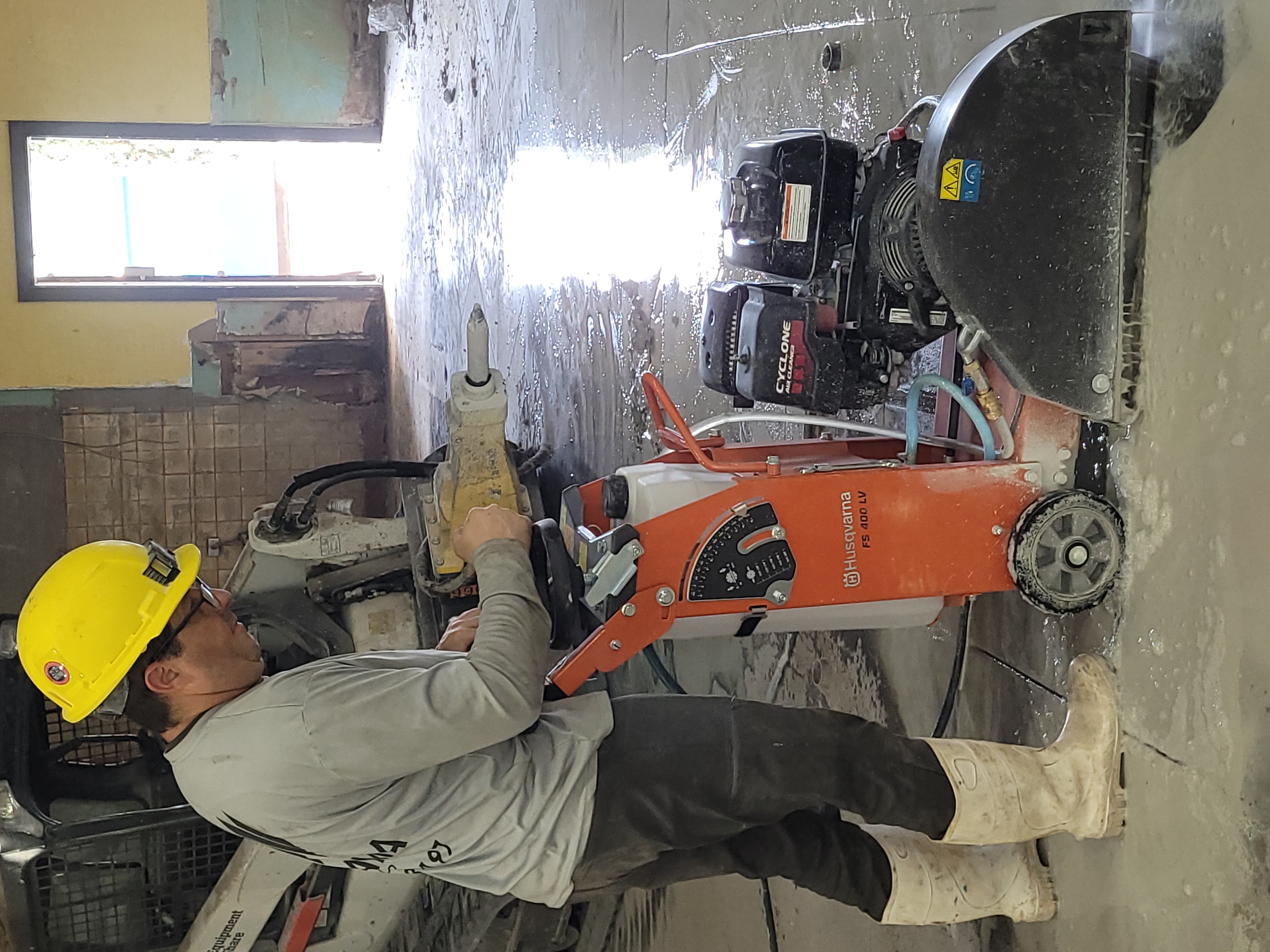 Natama Corp worker performing concrete cutting